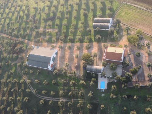 an overhead view of a farm with buildings and trees at Monte dos Aroeirais in Fronteira