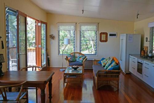 a living room with a couch and a table at Mia Mia in K'gari Island (Fraser Island)