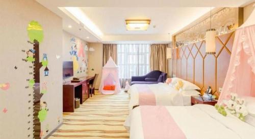 a childrens bedroom with two beds and a television at VX Hotel Chengdu Jiaolong Port Haibin in Chengdu