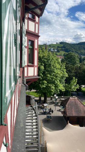 a view of a building with a table and chairs at Militärkantine St. Gallen in St. Gallen