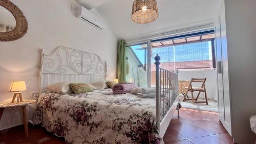 a bedroom with a bed and a window at Edita Apartments in Tivat