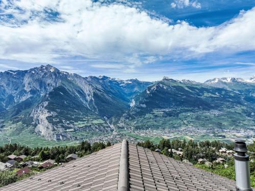 a view of the mountains from a roof at Chalet Chalet Boucaro by Interhome in Nendaz