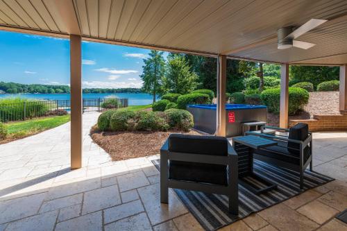 a screened in porch with a view of the water at Ringneck Retreat in Mooresville