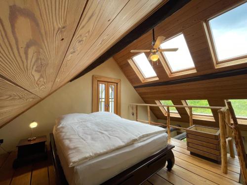 a bedroom with a bed in a attic at Ferienhaus Romantica in Bruttig-Fankel für 2 Personen in Bruttig-Fankel