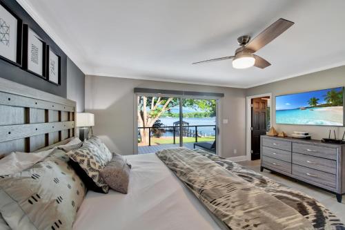 a bedroom with a large bed and a television at Southern Sunrise in Mooresville