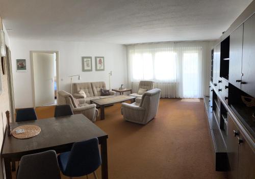 a living room with a couch and a table at Residenz Majesta in Leukerbad