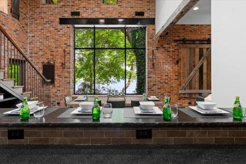 a dining room with a table and a large window at Ambassador Ridge w/Optional Boat Rental in Sherrills Ford