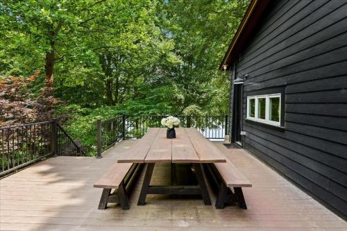 a wooden picnic table sitting on a deck at Ambassador Ridge w/Optional Boat Rental in Sherrills Ford