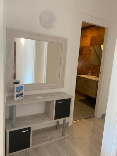 a bathroom with a large mirror and a sink at PASSAMANÉ 19 - Canillo - Casco Antiguo Hut 7867 in Canillo
