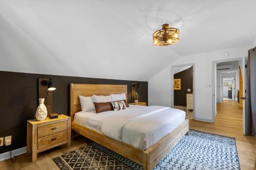 a bedroom with a large bed and a rug at Niblick on Norman w/Heated Pool & Optional Boat Rental in Cornelius