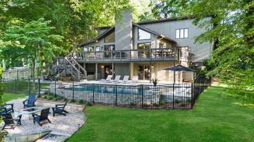 a house with a swimming pool in the yard at Niblick on Norman w/Heated Pool & Optional Boat Rental in Cornelius