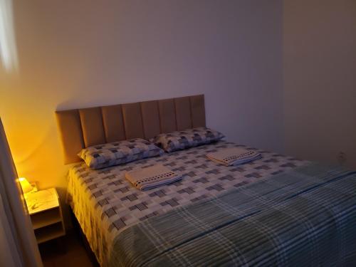 a bed with two pillows on it in a bedroom at Pousada Monte Gerizim in Sao Paulo