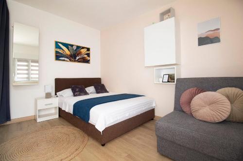 Ένα ή περισσότερα κρεβάτια σε δωμάτιο στο Studio Apartmani M