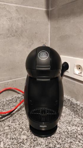 a black iron sitting on top of a counter at PASSAMANÉ 19 - Canillo - Casco Antiguo Hut 7867 in Canillo