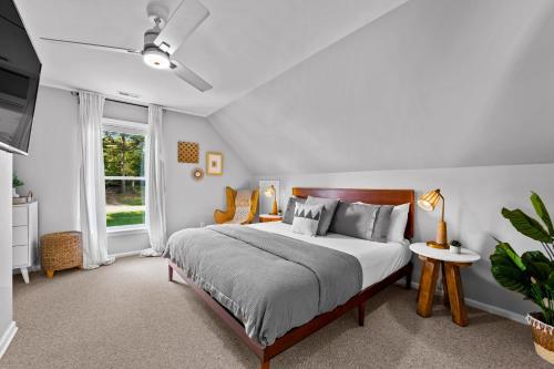 a bedroom with a bed and a window at Blue Wing Bay in Mooresville
