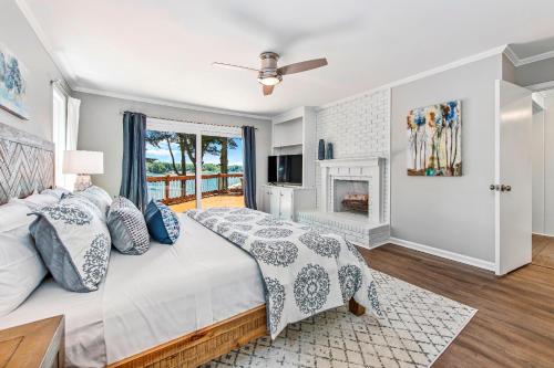 a bedroom with a large bed and a fireplace at Normandy Approach in Mooresville