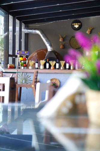 a room with a table and some plants and flowers at Aitch Boutique Hotel - an LIH Hotel in Madaba