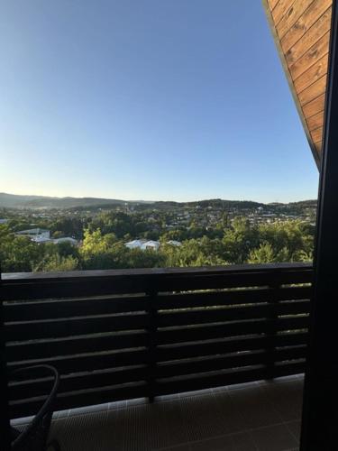 a view from the balcony of a house at Cottage on the Edge of the Forest in Surami in Surami