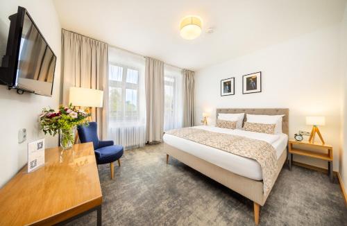 Postel nebo postele na pokoji v ubytování Residence Vyhlídka