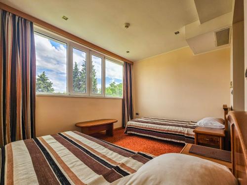 Postel nebo postele na pokoji v ubytování Mali Hotel BaMBiS
