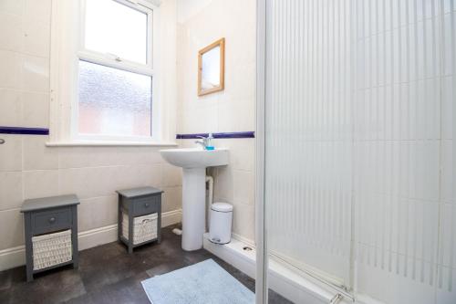 a bathroom with a sink and a shower at Pebbles guest house room 18 in Southampton