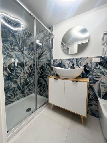 a bathroom with a shower and a sink and a mirror at Casa mia MadamA in Gaeta