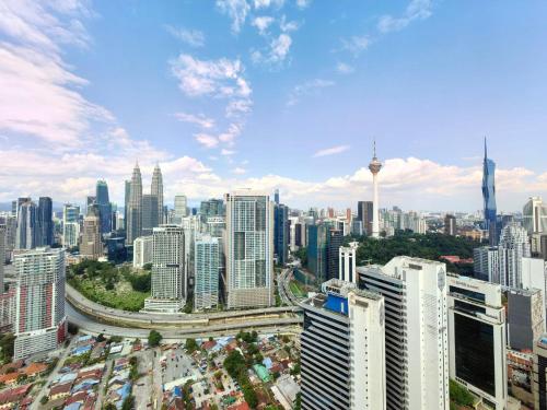 an aerial view of a city with tall buildings at The Luxe Colony KLCC By AZHA in Kuala Lumpur