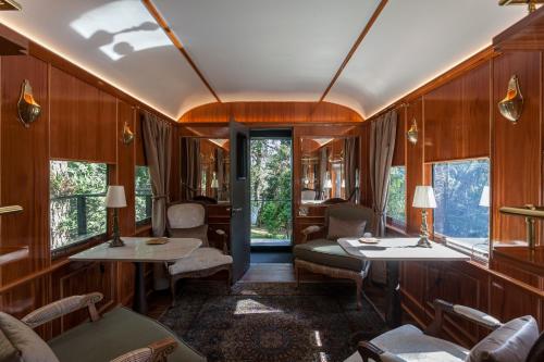 a train car with wood paneling and windows at Hotel Toriba in Campos do Jordão