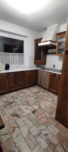 a kitchen with a tiled floor in a room at Adam room 1 in Wrocław