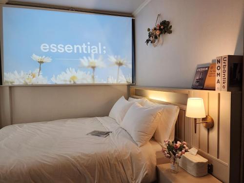 a hotel room with a bed and a large window at Lucy Stay in Seoul