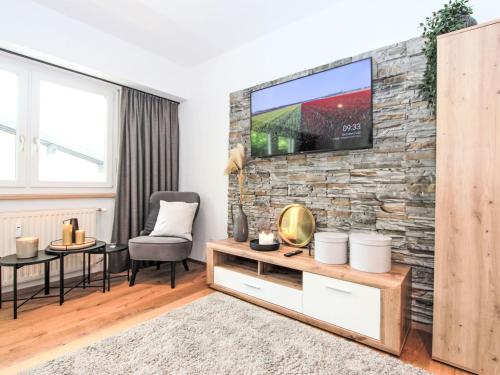 TV a/nebo společenská místnost v ubytování Apartment Am Birkenhain-3 by Interhome