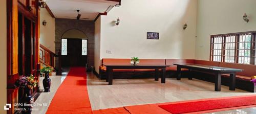 a room with two ping pong tables in a building at NAVARATHNA International resort in Sollebail