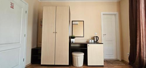 a bathroom with a sink and a cabinet with a mirror at Respekt Guest House in Sunny Beach