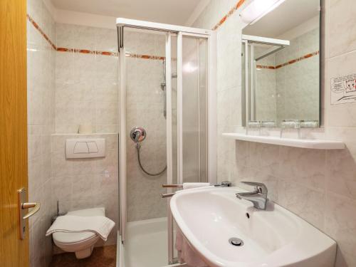 a bathroom with a sink and a shower and a toilet at Apartment Nr- 17 by Interhome in Solda