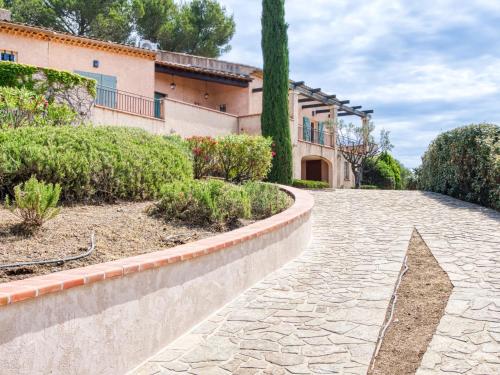 a cobblestone driveway in front of a house at Holiday Home Le Belvédère d'Estelle by Interhome in Pierrefeu-du-Var