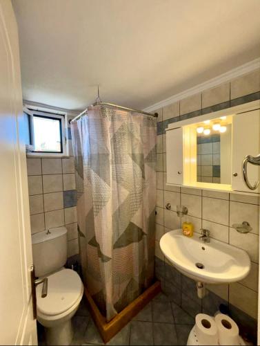 a bathroom with a toilet and a sink at "Twin Apartments" in Kyparissia in Kyparissia