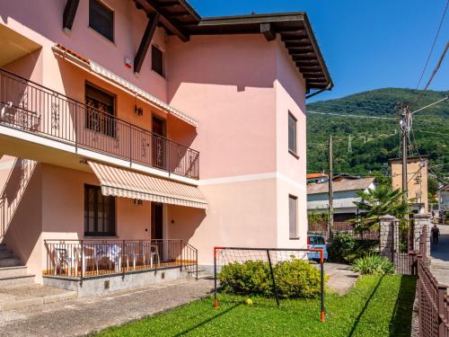 a house with a balcony and a yard at Apartment La Casa di Bianca by Interhome in Dongo