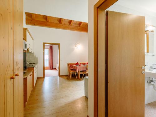 a kitchen and dining room with a dining room table at Apartment Nr- 19 by Interhome in Solda