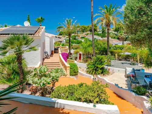 an aerial view of a house with palm trees at Villa Charme by Interhome in Jávea