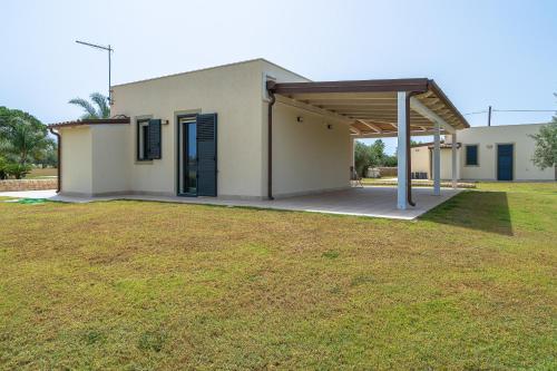 a house with a large yard in front of it at Agrivillage San Lorenzo in San Lorenzo