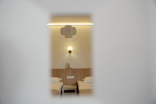 a view of a living room through a window at Shanghai Yi Du B&B - Near Nanjing West Road commercial district, 350 walk from the Natural History Museum subway in Shanghai