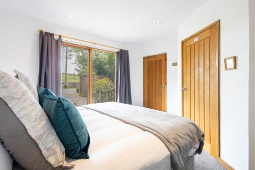 a bedroom with a bed and a window at Host & Stay - Crackin' View in Hexham