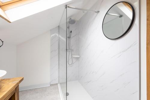 a glass shower in a bathroom with a mirror at Host & Stay - Crackin' View in Hexham