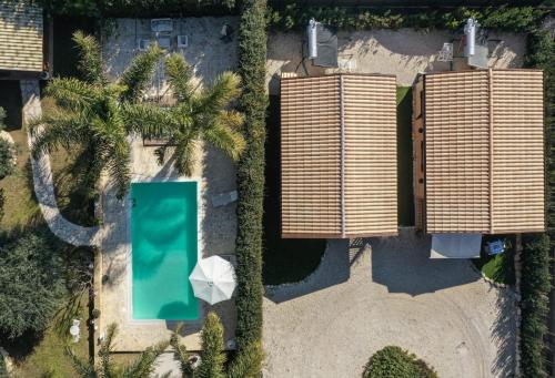 an overhead view of two buildings with a pool at Casa Vacanze La Fenice - Casa Atlantica in Cava dʼAliga