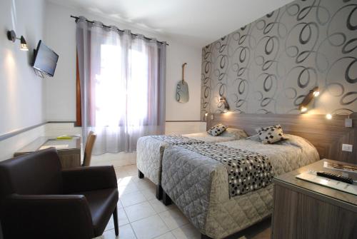 Cama o camas de una habitación en Hostellerie du Perigord Vert-Logis