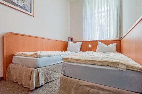 Ένα ή περισσότερα κρεβάτια σε δωμάτιο στο Villa Viktoria Whg 4 - "Kapitänskoje"