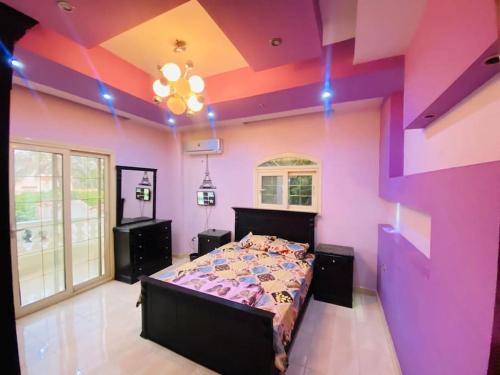 En eller flere senge i et værelse på ڤيلا الرمز كينج مريوط الإسكندرية