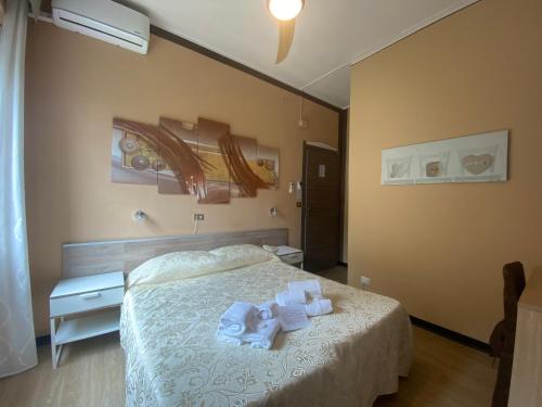 Ένα ή περισσότερα κρεβάτια σε δωμάτιο στο Hotel Eva La Romantica