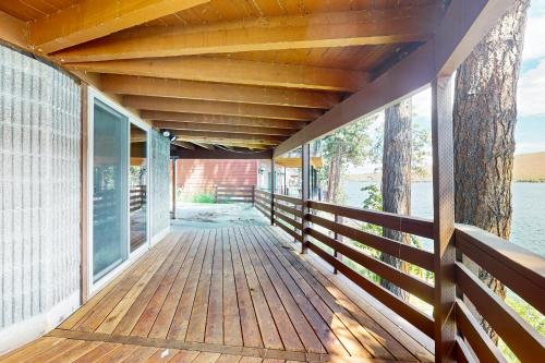 a porch of a house with a wooden deck at Water's Edge Haven in Joseph