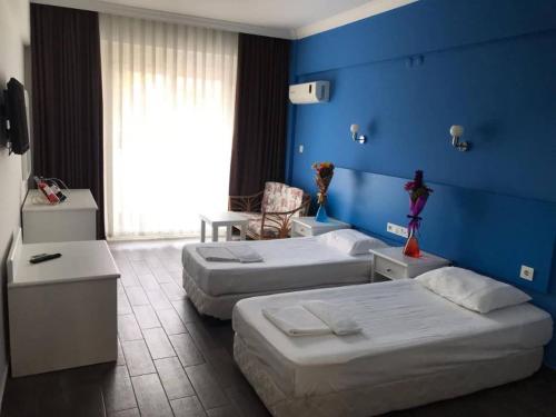 Postel nebo postele na pokoji v ubytování Hancı apart